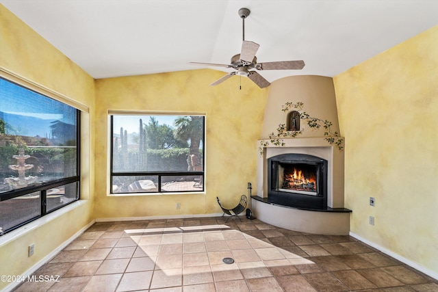 unfurnished living room featuring ceiling fan