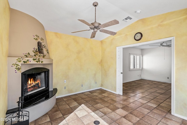 unfurnished living room with vaulted ceiling and ceiling fan