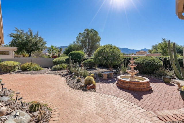 view of patio / terrace with a mountain view