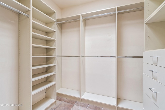 walk in closet featuring light tile patterned floors