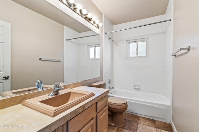 full bathroom with tiled shower / bath combo, vanity, and toilet