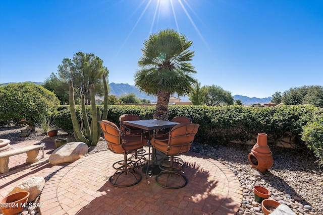 view of patio / terrace featuring a mountain view