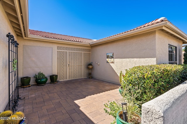 entrance to property with a patio