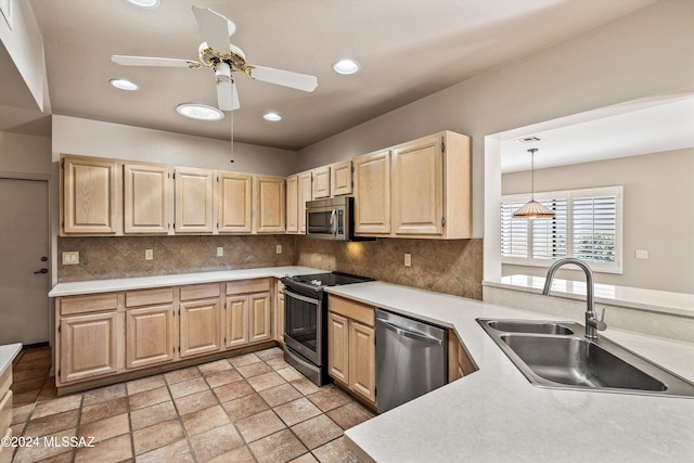 kitchen featuring sink, appliances with stainless steel finishes, backsplash, hanging light fixtures, and light brown cabinetry