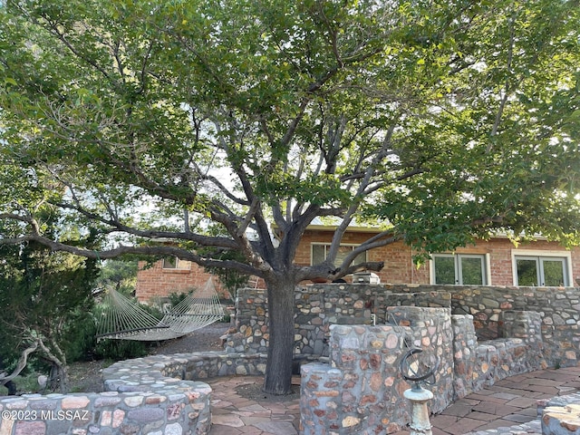 view of front of home featuring brick siding