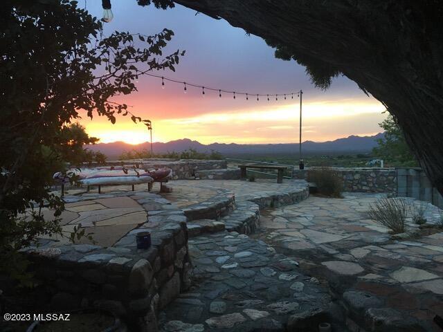 patio terrace at dusk with a mountain view