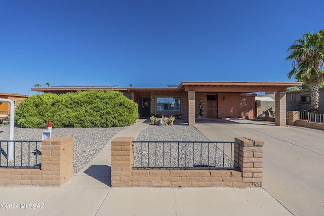 view of front of home with a carport