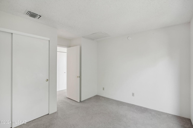 spare room featuring a textured ceiling