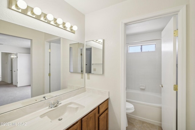 bathroom featuring tile patterned floors, vanity, and toilet