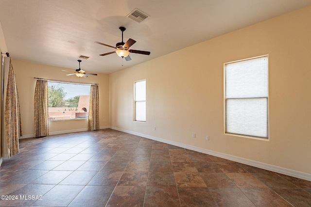 empty room featuring ceiling fan