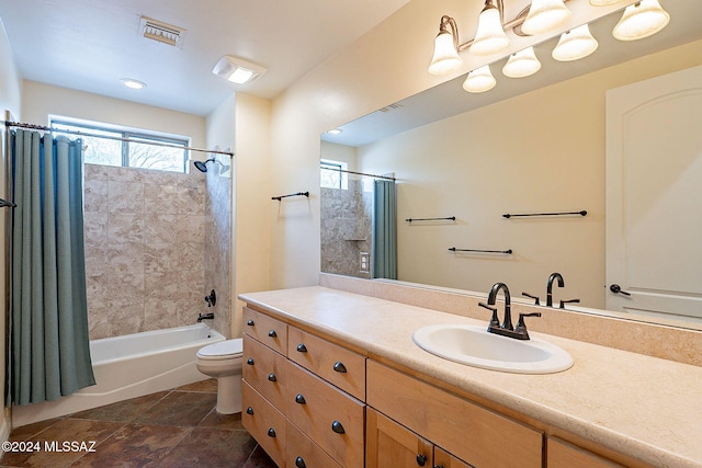 full bathroom with shower / bath combo, toilet, and vanity