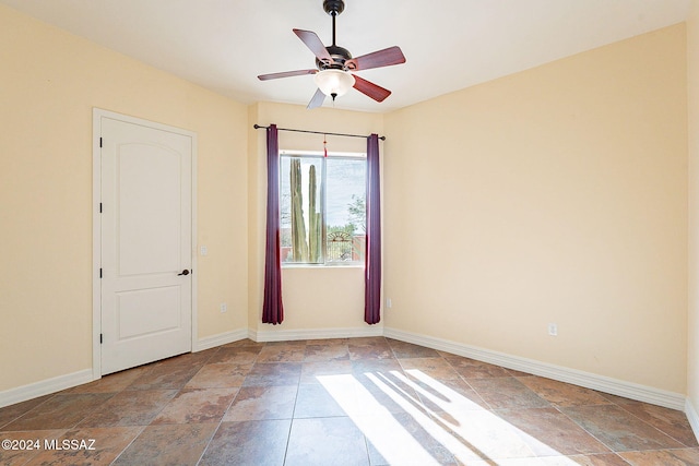 spare room with ceiling fan