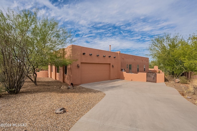 adobe home featuring a garage