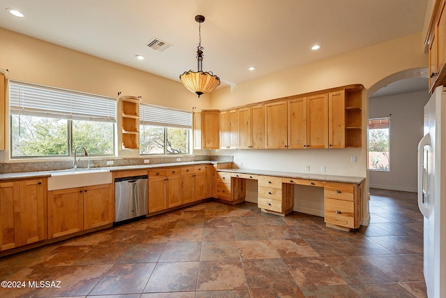 kitchen featuring sink, pendant lighting, built in desk, white refrigerator, and dishwasher