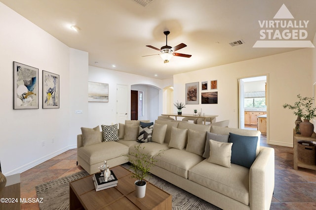 living room featuring ceiling fan