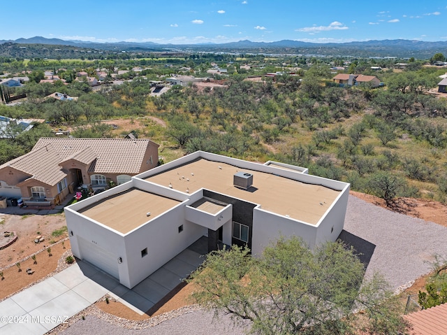 birds eye view of property featuring a mountain view