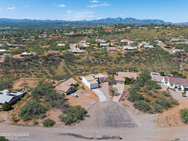 birds eye view of property with a mountain view