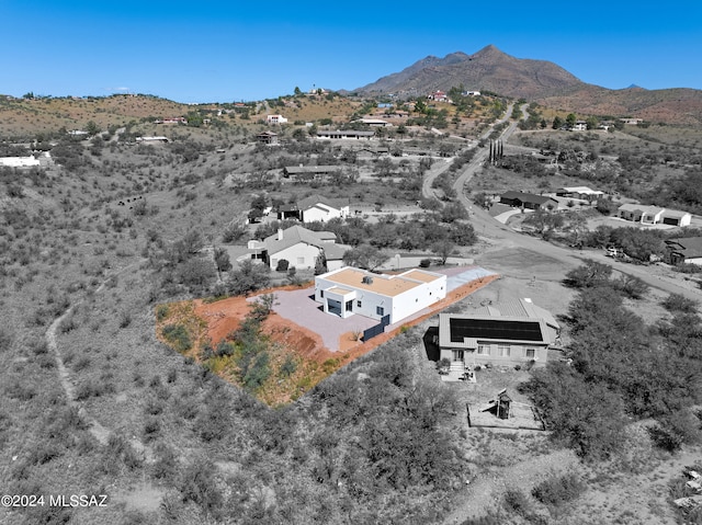 birds eye view of property featuring a mountain view