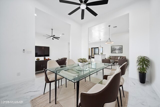 dining area with ceiling fan