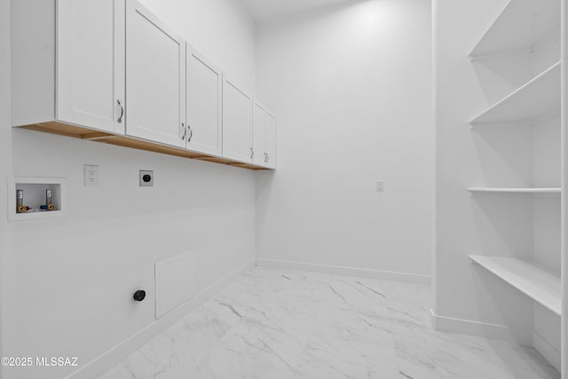 clothes washing area featuring cabinets, electric dryer hookup, and washer hookup