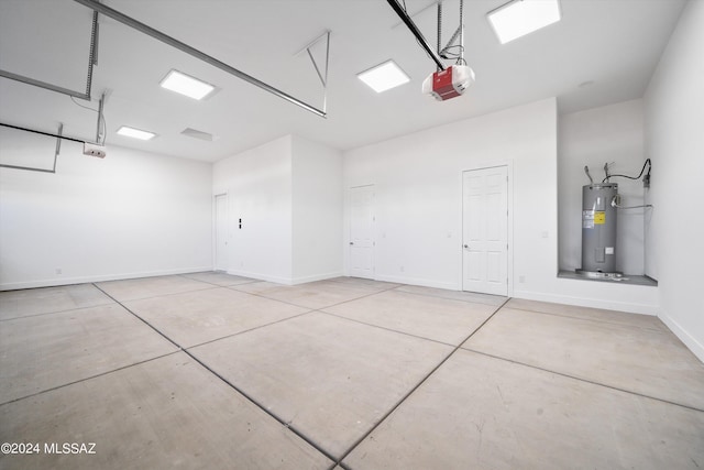 garage featuring a garage door opener and water heater