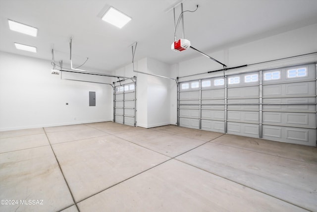 garage featuring a garage door opener and electric panel