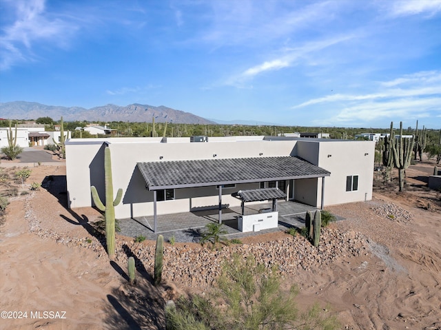 back of house featuring a mountain view