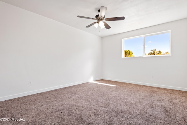 spare room featuring ceiling fan and carpet flooring