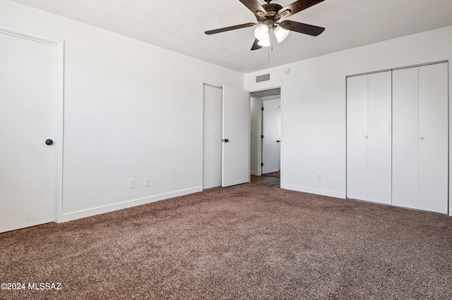 unfurnished bedroom with ceiling fan and carpet flooring