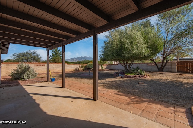 view of patio / terrace featuring a mountain view