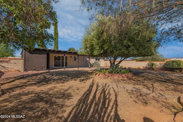 back of property featuring a patio area