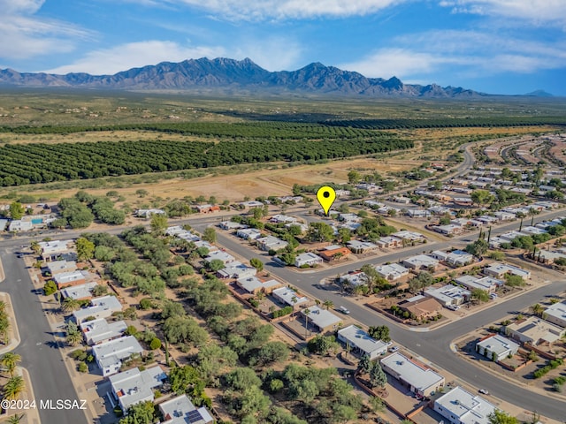 birds eye view of property with a mountain view