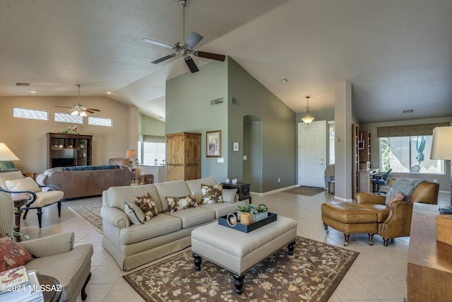 tiled living room featuring high vaulted ceiling, plenty of natural light, and ceiling fan