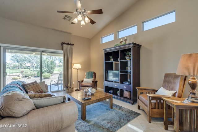 living room featuring ceiling fan, light tile patterned floors, and high vaulted ceiling