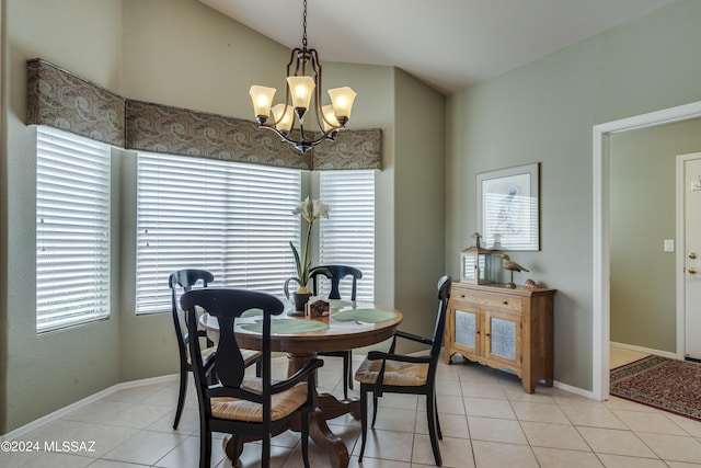 dining room featuring light tile patterned floors, lofted ceiling, and an inviting chandelier