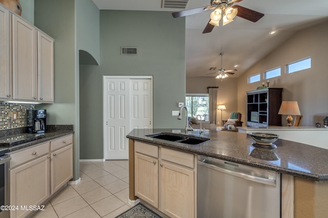 kitchen with ceiling fan, dishwasher, sink, tasteful backsplash, and light tile patterned floors