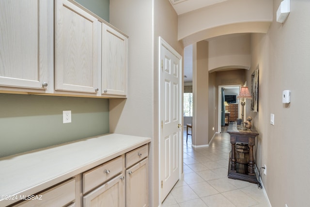 hallway featuring light tile patterned floors