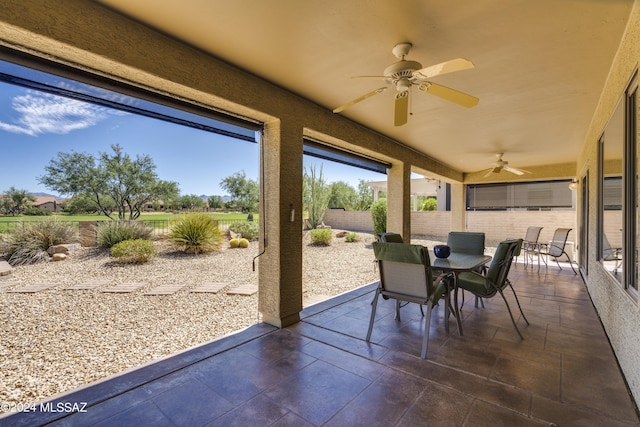 sunroom / solarium with ceiling fan