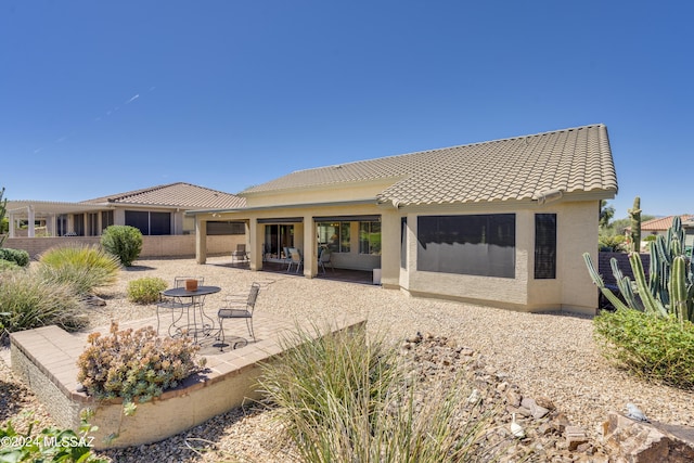 rear view of property with a patio area