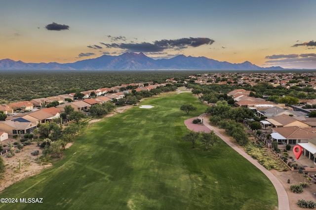 aerial view at dusk featuring a mountain view