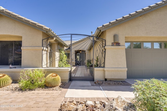 view of exterior entry featuring a garage