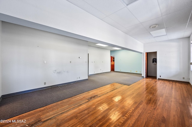 unfurnished room featuring a paneled ceiling and hardwood / wood-style floors