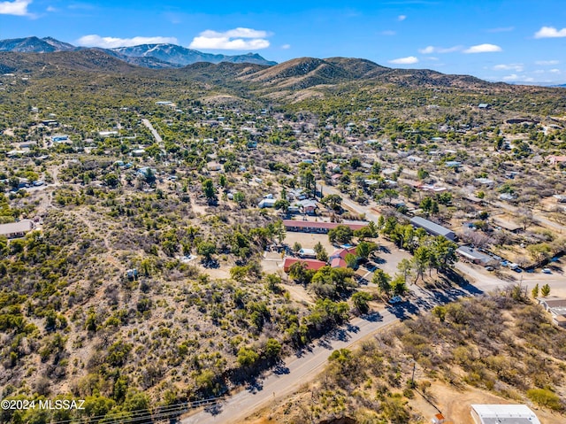 birds eye view of property featuring a mountain view