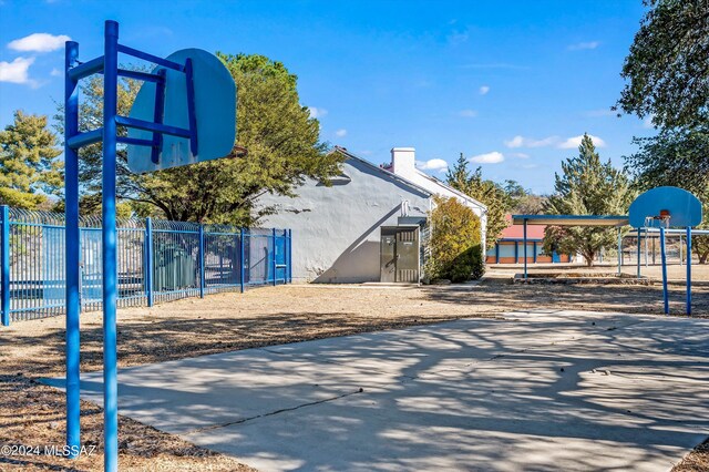 exterior space featuring basketball hoop