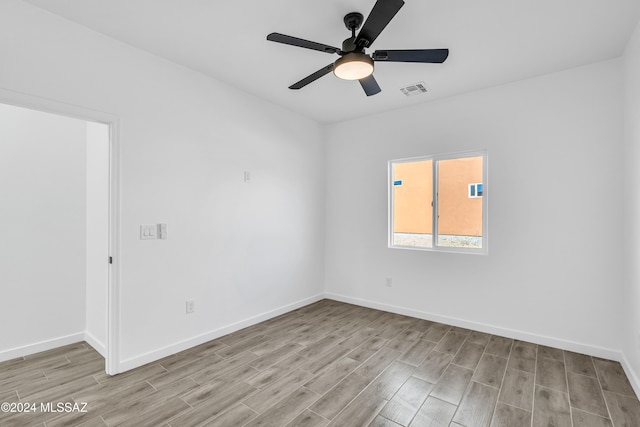 unfurnished room featuring light hardwood / wood-style floors and ceiling fan