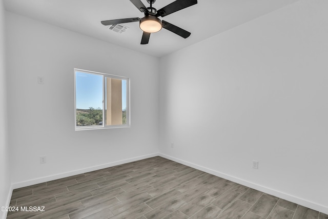 unfurnished room with light wood-type flooring and ceiling fan