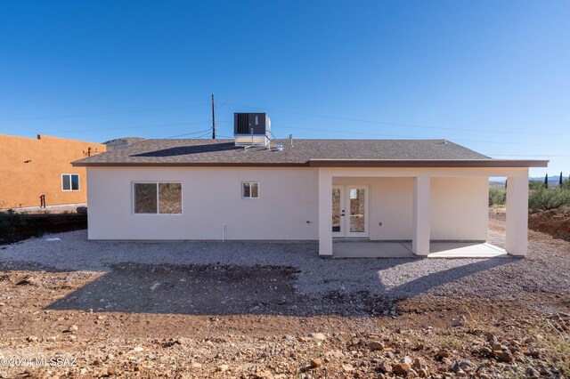 back of property with a patio area and cooling unit