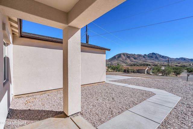 view of patio / terrace featuring a mountain view