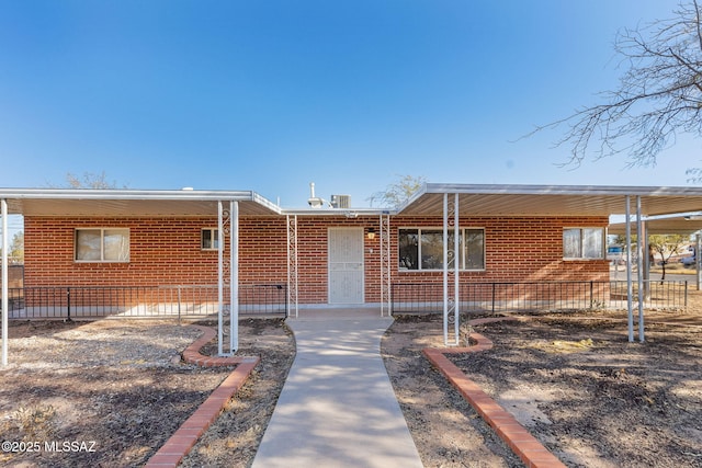 view of front of property featuring a carport