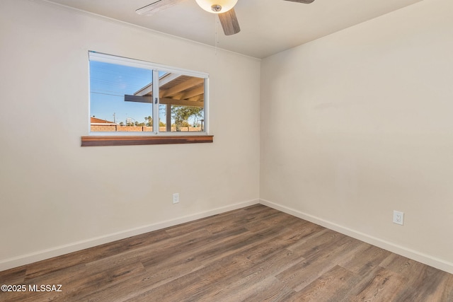 spare room with hardwood / wood-style flooring, ceiling fan, and ornamental molding